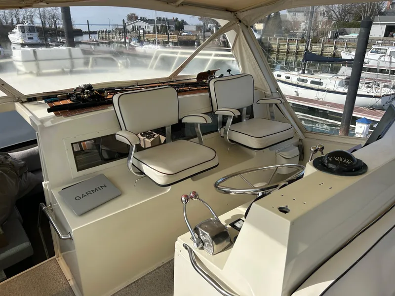 Slide: The Image of 1985 Viking 50 Cockpit MY boat interior with helm, seats, and Garmin equipment. - 40