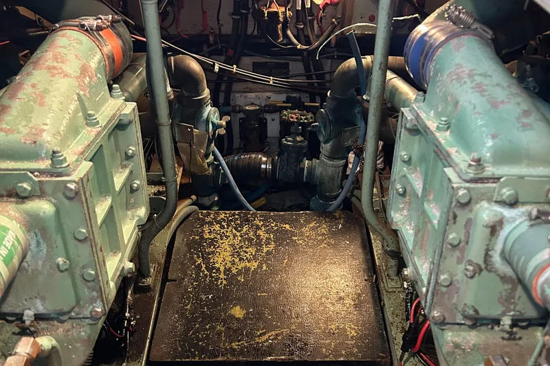 Slide: The Image of Engine room of a 1985 Viking 50 Cockpit MY yacht, showing machinery and components. - 41