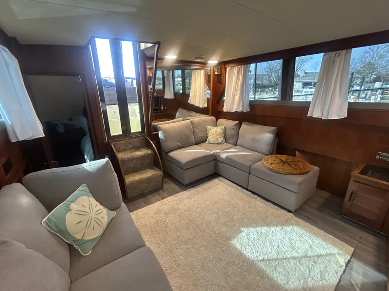 Slide: The Image of Interior of 1985 Viking 50 Cockpit MY yacht with cozy seating and natural light. - 9