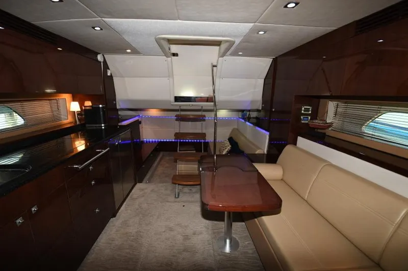 Slide: The Image of Luxurious interior of 2010 Sea Ray 450 Sundancer yacht with modern furnishings and ambient lighting. - 17