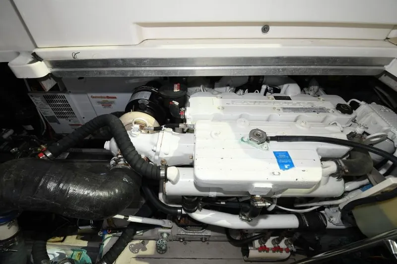 Slide: The Image of Engine compartment of a 2010 Sea Ray 450 Sundancer boat, showcasing mechanical components. - 18
