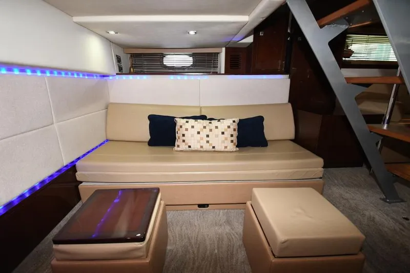 Slide: The Image of Interior of 2010 Sea Ray 450 Sundancer yacht with beige seating and modern decor. - 26