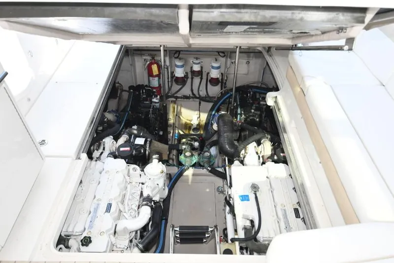 Slide: The Image of Engine compartment of 2010 Sea Ray 450 Sundancer, showcasing dual engines and mechanical components. - 31
