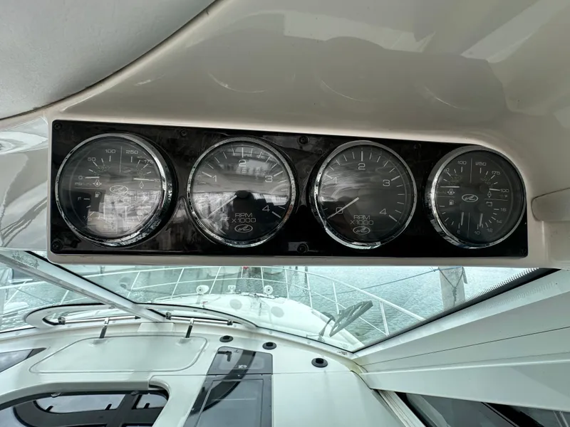 Slide: The Image of Dashboard gauges on a 2010 Sea Ray 470 Sundancer yacht. - 12