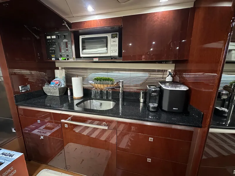 Slide: The Image of Luxurious kitchen interior of 2010 Sea Ray 470 Sundancer yacht with modern appliances. - 22