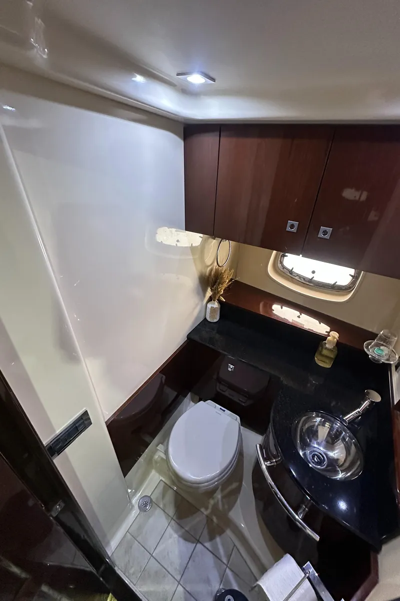 Slide: The Image of Luxurious bathroom in 2010 Sea Ray 470 Sundancer yacht with modern fixtures and elegant design. - 24