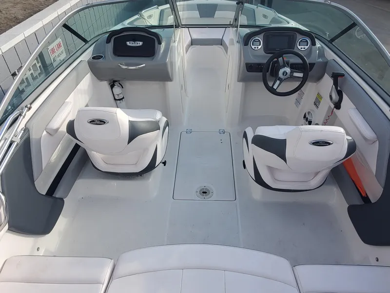 Slide: The Image of 2020 Chaparral 21 SSi OB boat interior with dual seats and steering console. - 1