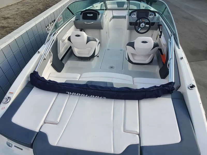 Slide: The Image of 2020 Chaparral 21 SSi OB boat interior with seating and steering wheel. - 2