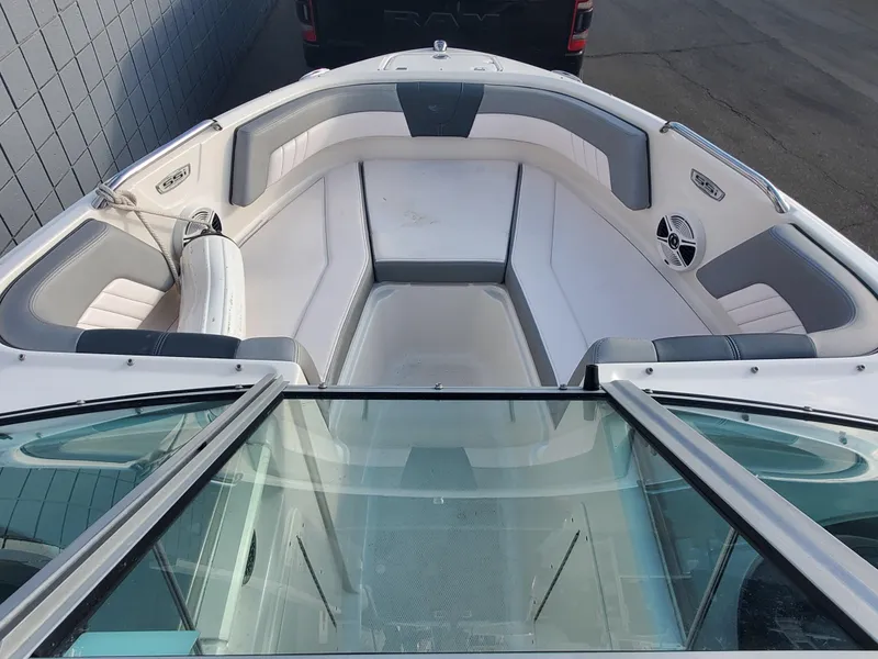 Slide: The Image of 2020 Chaparral 21 SSi OB boat interior with white and gray seating. - 3