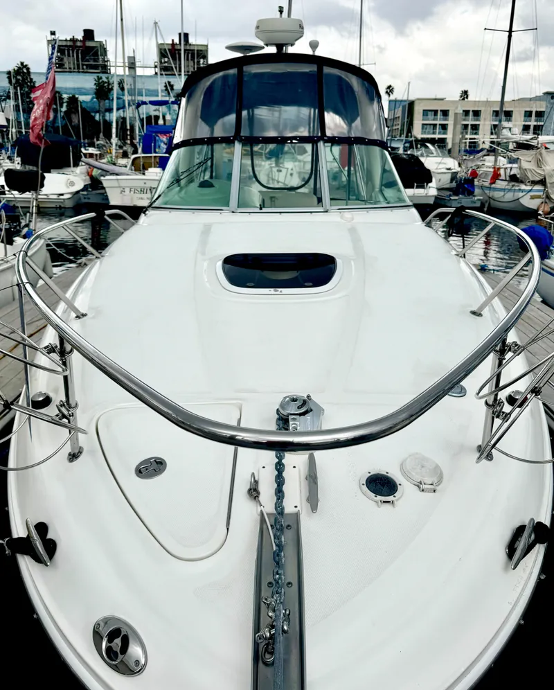 Slide: The Image of 2005 Sea Ray Sundancer 260 docked, front view. - 2