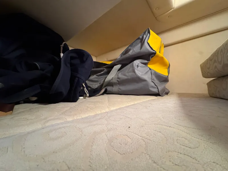Slide: The Image of Interior cabin of 2005 Sea Ray Sundancer 260 with storage bags. - 20
