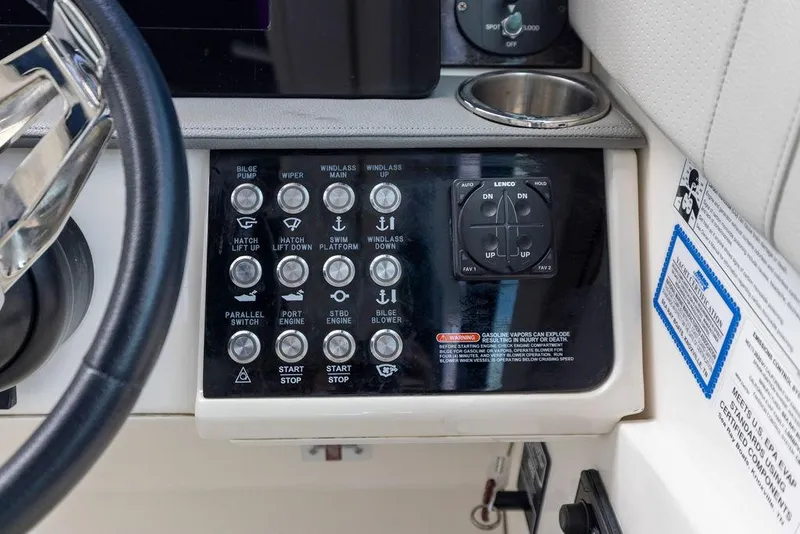 Slide: The Image of Control panel of 2020 Sea Ray Sundancer 320 boat with various switches and buttons. - 26