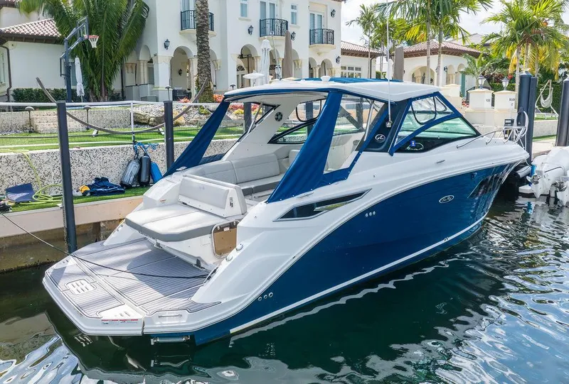Slide: The Image of 2020 Sea Ray Sundancer 320 docked, featuring sleek design and luxurious amenities. - 3