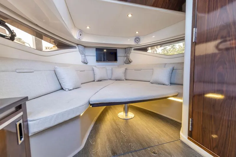 Slide: The Image of 2020 Sea Ray Sundancer 320 interior with cozy seating and modern design. - 42
