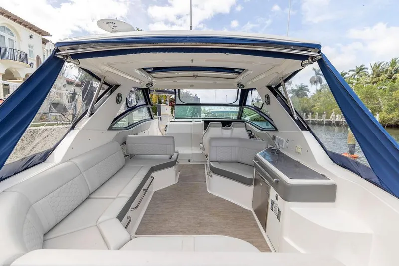 Slide: The Image of 2020 Sea Ray Sundancer 320 interior with spacious seating and modern amenities. - 8