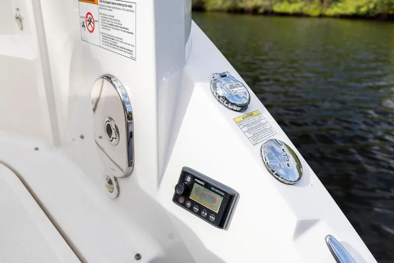 Slide: The Image of 2020 Sea Ray Sundancer 320 boat controls and fittings by the water. - 9