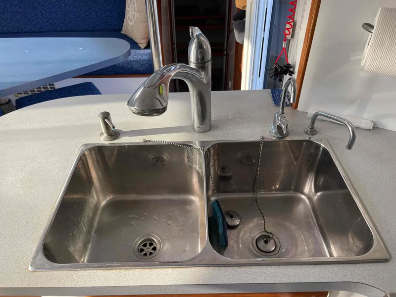 Slide: The Image of Double sink in a 2000 Manta 42 Catamaran kitchen area. - 16