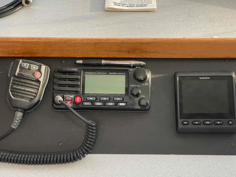 Slide: The Image of Control panel of a 2000 Manta 42 Catamaran with radio and Garmin display. - 20