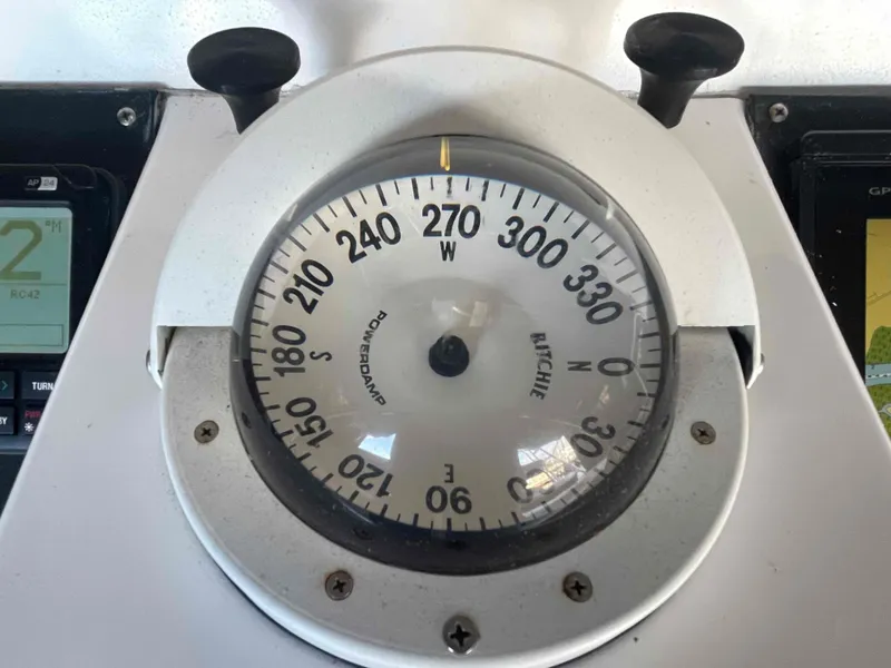 Slide: The Image of Compass on 2000 Manta 42 Catamaran dashboard, showing heading direction. - 40