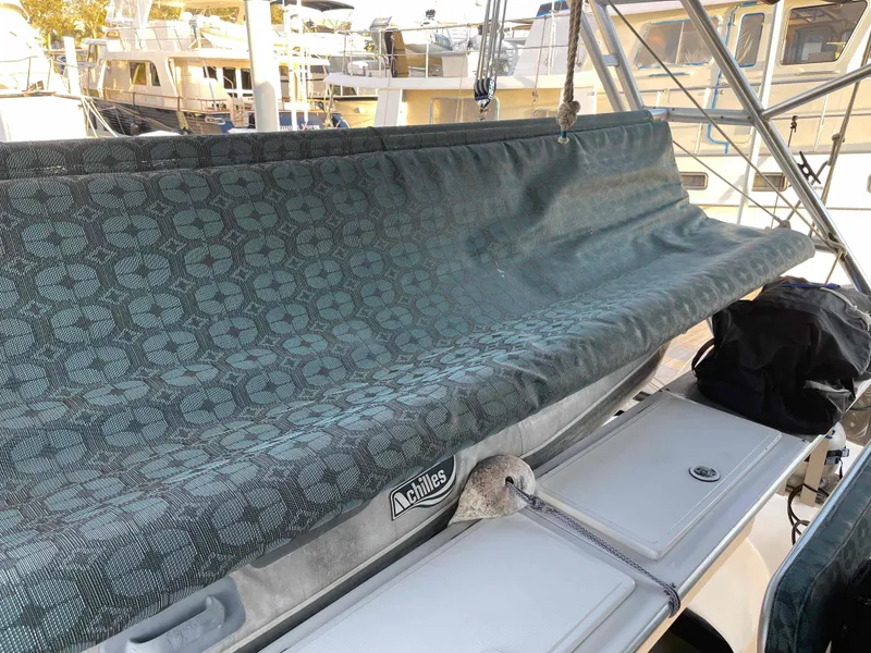 Slide: The Image of Manta 42 Catamaran 2000 with covered seating area, docked at marina. - 47