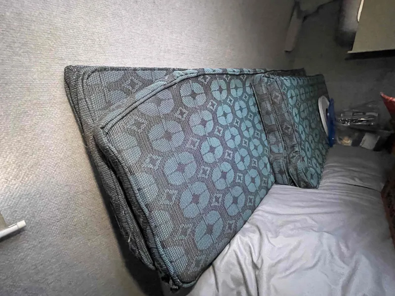 Slide: The Image of Cushions with geometric patterns inside a 2000 Manta 42 Catamaran cabin. - 49