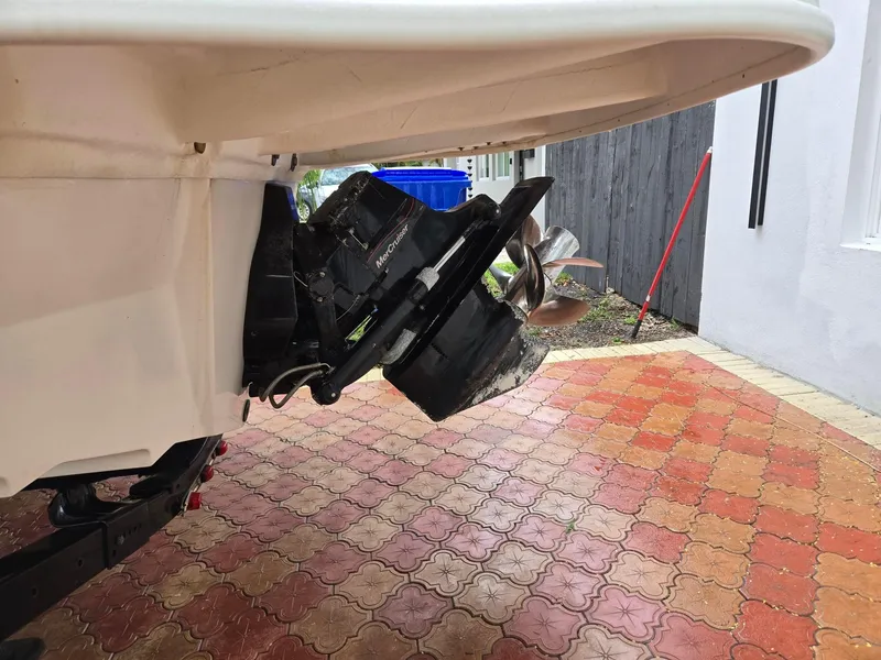 Slide: The Image of 2015 Sea Ray 220 Sundeck boat propeller on a tiled driveway. - 11