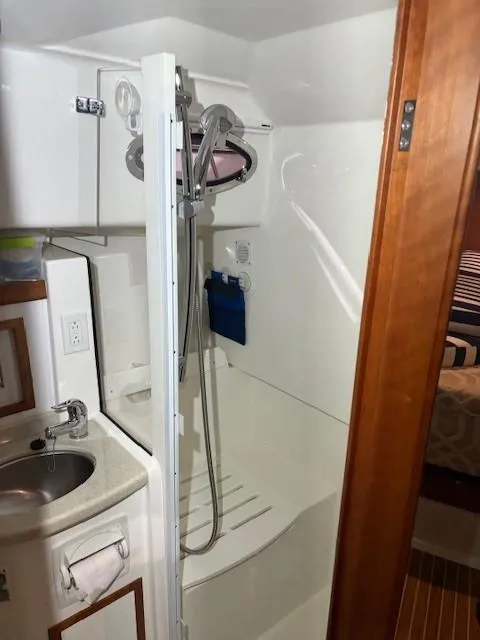 Slide: The Image of 2013 Back Cove 34 yacht bathroom with shower and sink. - 14