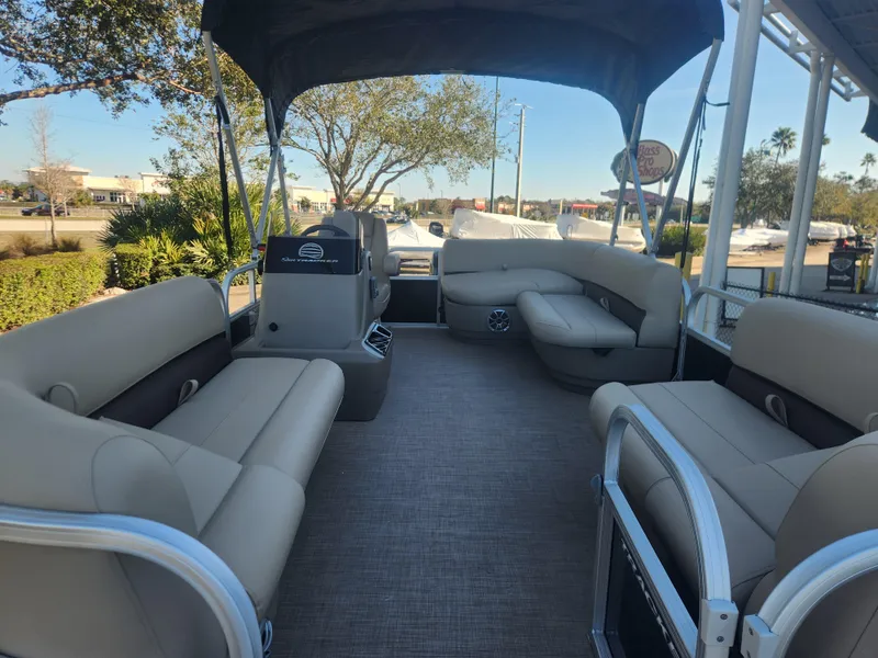 Slide: The Image of 2025 Sun Tracker Party Barge 16 DLX interior with spacious seating and canopy. - 4
