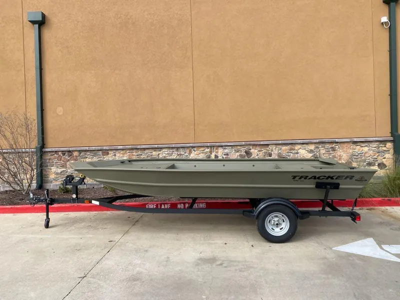 The Image of 2025 Tracker Grizzly 1754 Jon boat on trailer, parked outdoors. - 0