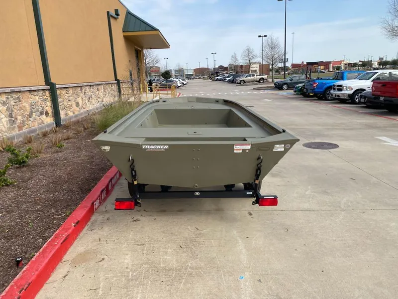 Slide: The Image of 2025 Tracker Grizzly 1754 Jon boat on trailer in parking lot. - 3