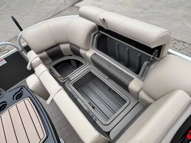 Slide: The Image of 2023 Sun Tracker Party Barge 22 RF XP3 interior with open storage compartments. - 10