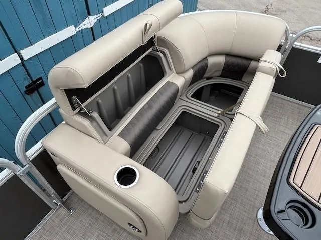 Slide: The Image of 2023 Sun Tracker Party Barge 22 RF XP3 interior seating with storage compartments open. - 12