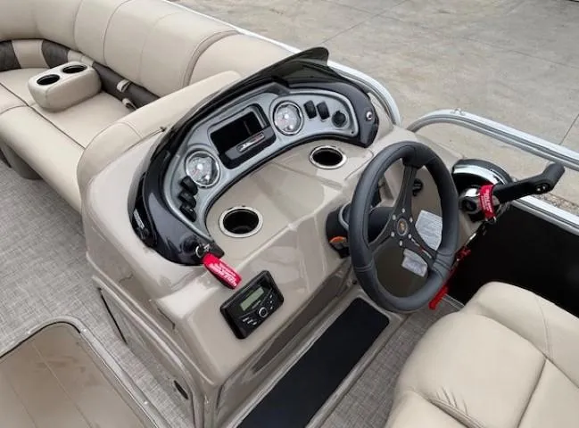 Slide: The Image of 2023 Sun Tracker Party Barge 22 RF XP3 dashboard with steering wheel and controls. - 15