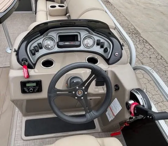 Slide: The Image of 2023 Sun Tracker Party Barge 22 RF XP3 dashboard with steering wheel and controls. - 16