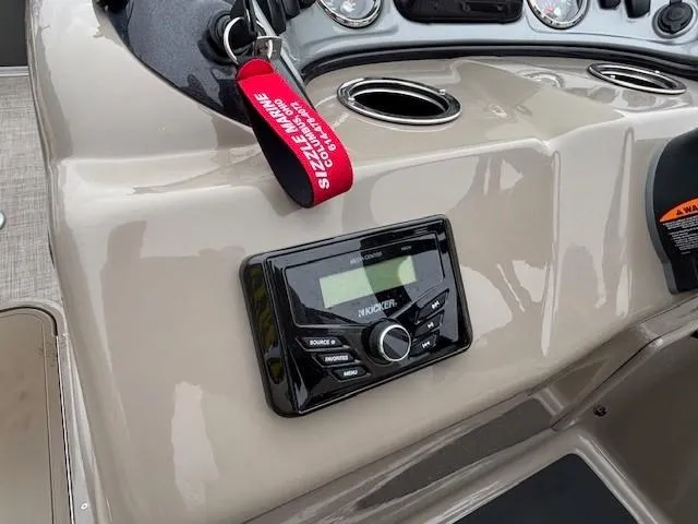 Slide: The Image of 2023 Sun Tracker Party Barge 22 RF XP3 dashboard with audio system and keychain. - 17