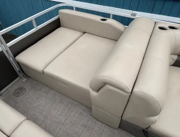Slide: The Image of 2023 Sun Tracker Party Barge 22 RF XP3, beige seating, spacious layout, cup holders. - 24