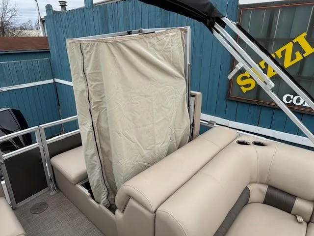 Slide: The Image of 2023 Sun Tracker Party Barge 22 RF XP3 with beige seating and privacy curtain. - 27