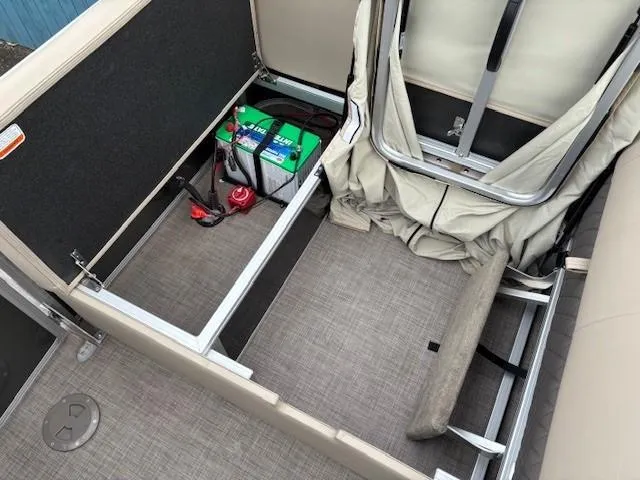 Slide: The Image of 2023 Sun Tracker Party Barge 22 RF XP3 interior storage with battery compartment. - 28