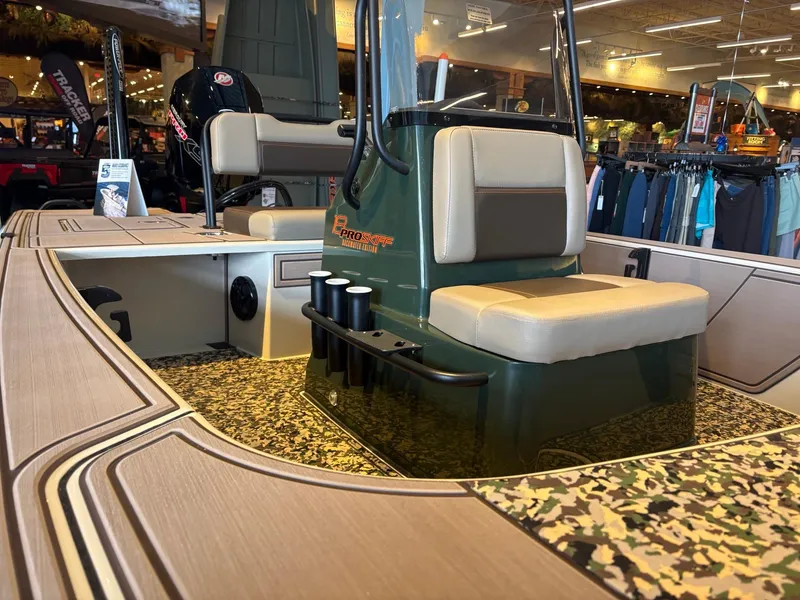 Slide: The Image of 2025 Mako 18 Pro Skiff Backwater Edition interior with seating and rod holders. - 2