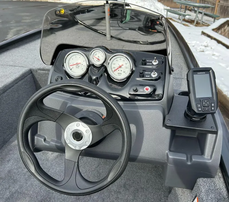 Slide: The Image of 2025 Tracker Pro 170 boat dashboard with steering wheel and gauges. - 5