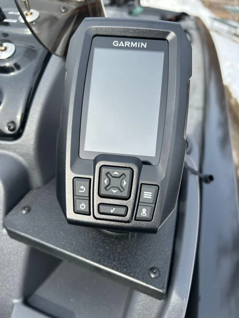Slide: The Image of Garmin device on 2025 Tracker Pro 170 boat dashboard, featuring navigation controls. - 6