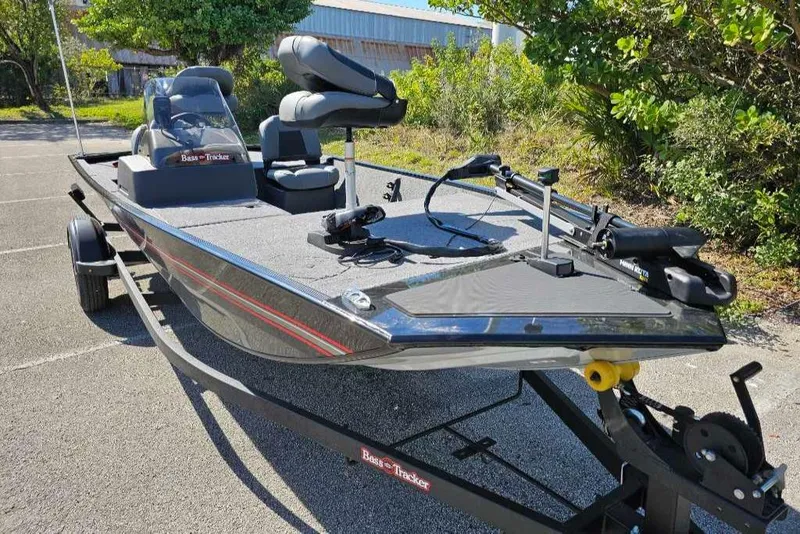 Slide: The Image of 2025 Tracker Bass Tracker Classic XL boat on trailer, parked outdoors. - 3