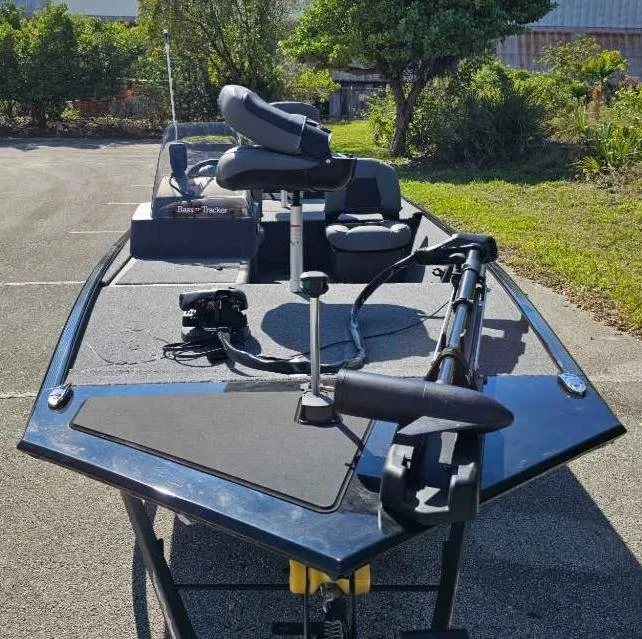 Slide: The Image of 2025 Tracker Bass Tracker Classic XL boat with fishing seats and equipment on deck. - 5