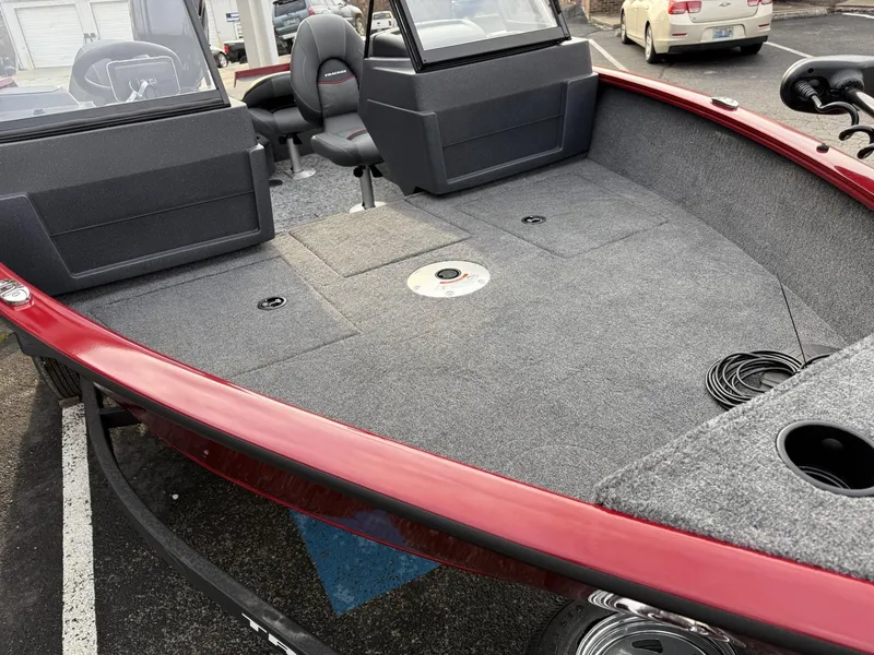 Slide: The Image of 2025 Tracker Pro Guide V-175 WT boat interior with seating and carpeted deck. - 10