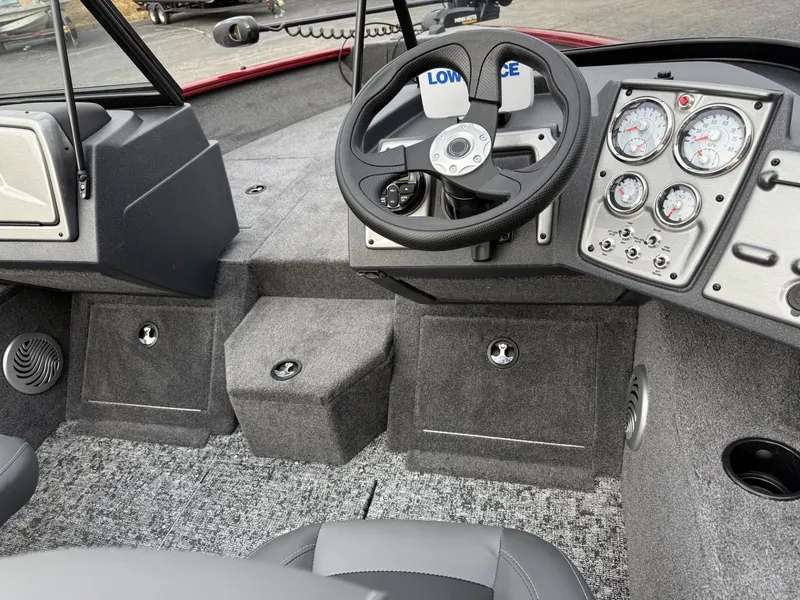 Slide: The Image of 2025 Tracker Pro Guide V-175 WT boat interior with steering wheel and instrument panel. - 13