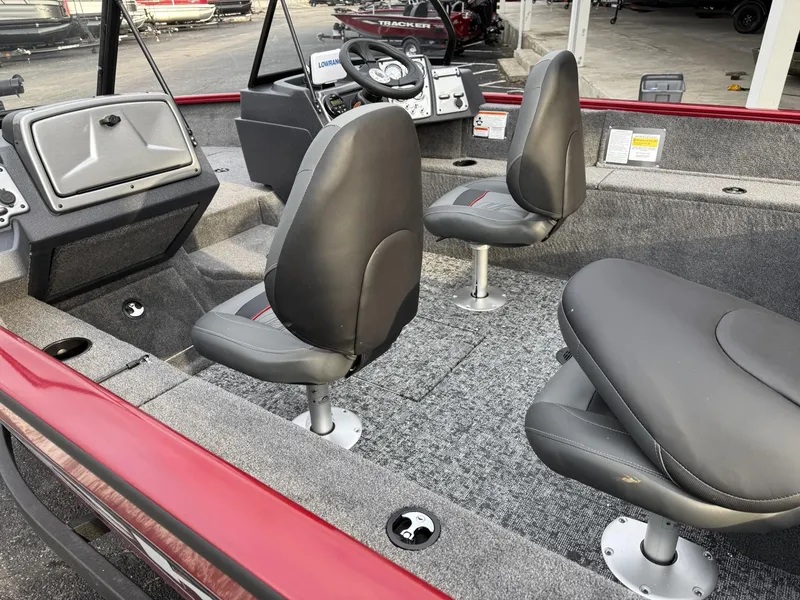 Slide: The Image of 2025 Tracker Pro Guide V-175 WT boat interior with two seats and steering console. - 6