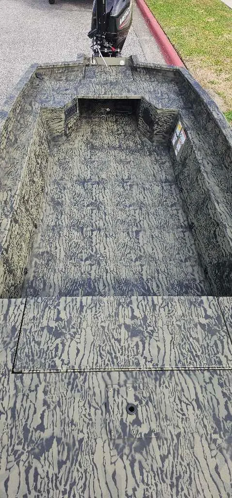 Slide: The Image of 2025 Tracker Grizzly 1650 T Prairie Wings Edition boat with camouflage interior design. - 4