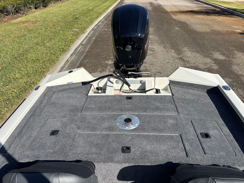 Slide: The Image of 2025 Tracker Pro Team 175 Crappie Edition boat, rear view with motor and deck. - 3