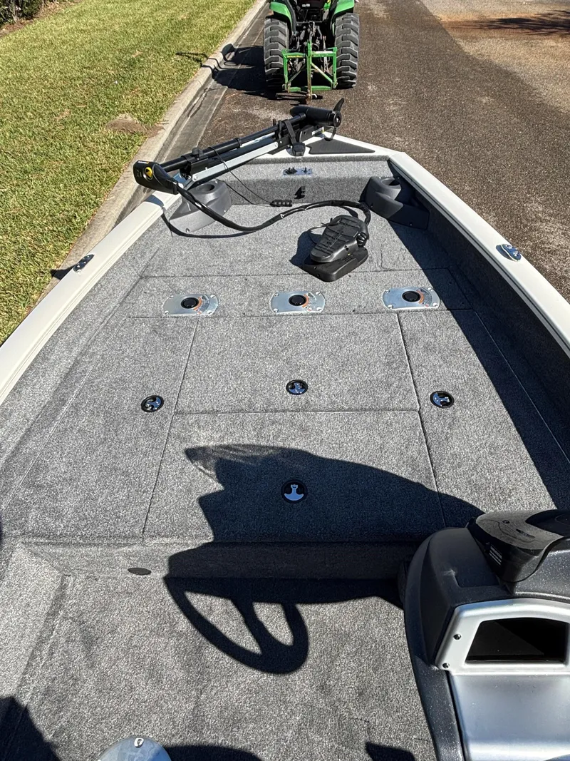 Slide: The Image of 2025 Tracker Pro Team 175 Crappie Edition boat with carpeted deck and trolling motor. - 4