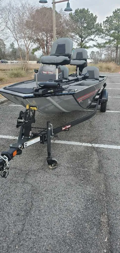 Slide: The Image of 2025 Tracker Bass Tracker Classic XL boat on trailer in parking lot. - 4